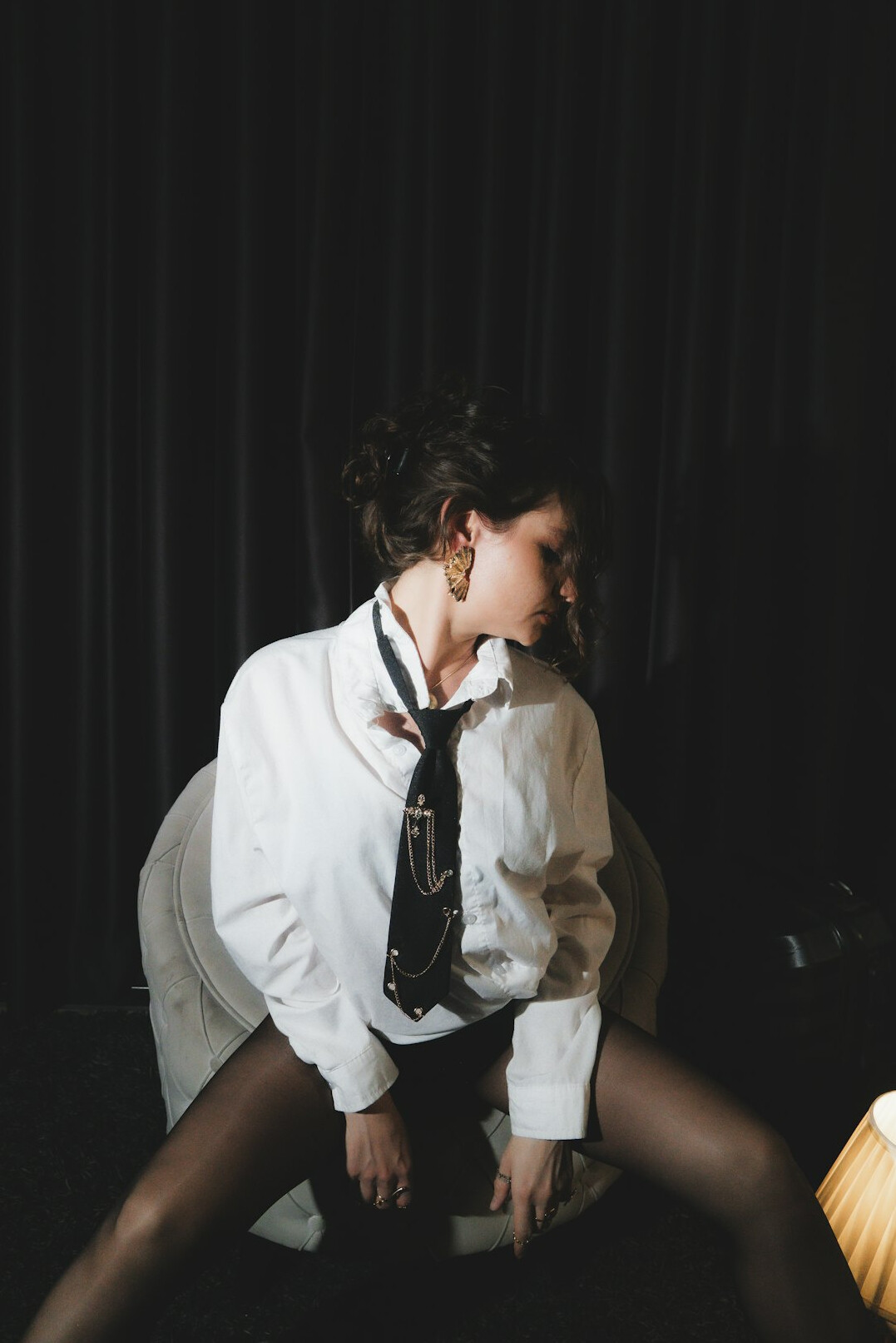 Portrait of a woman with dark hair in a studio setting
