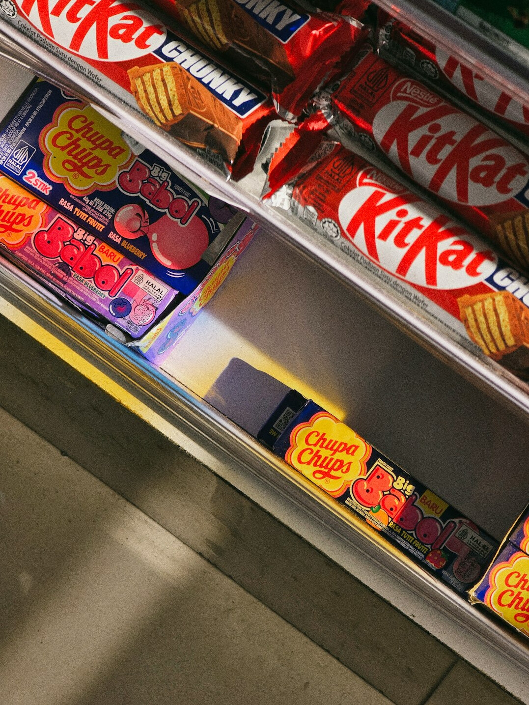 store detective catching thief in candy aisle