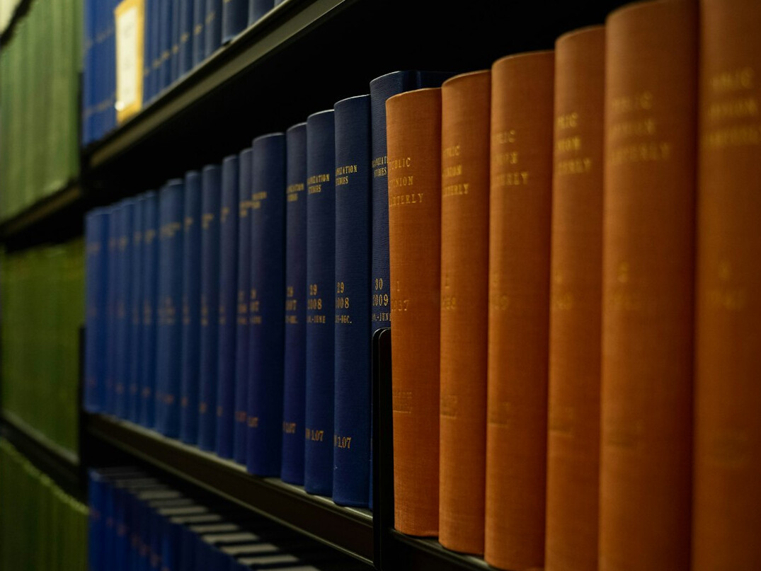 Rows of bound court record books on a shelf