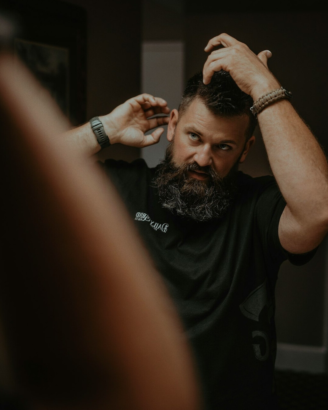Portrait of a man with a short beard in a studio setting